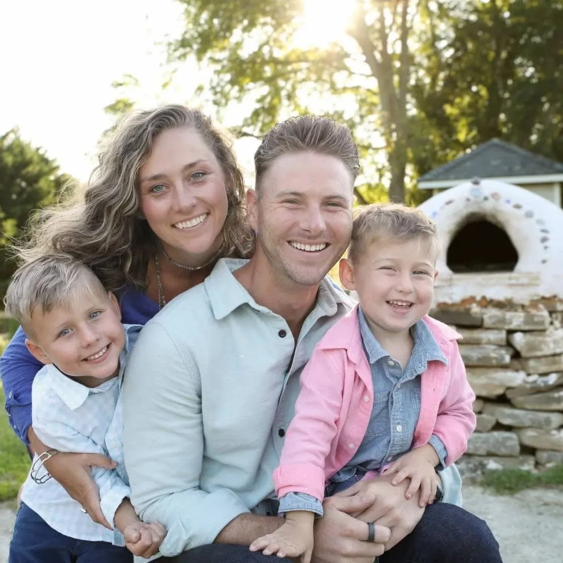 Chiropractor Dr. Tony Miller and his family together smiling