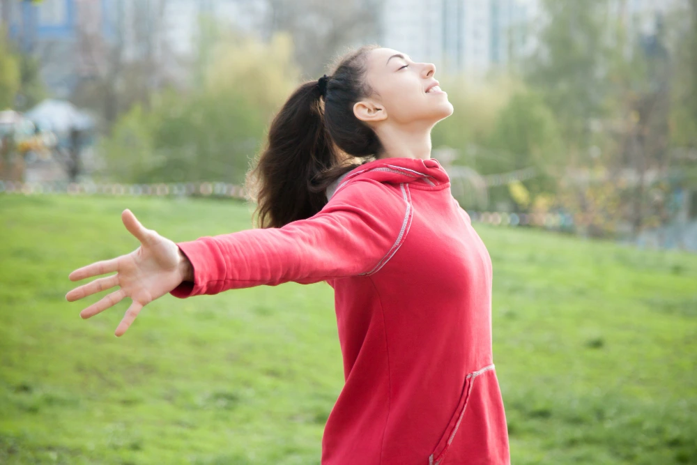 Healthy woman feeling energized representing strong immune and nervous system connection