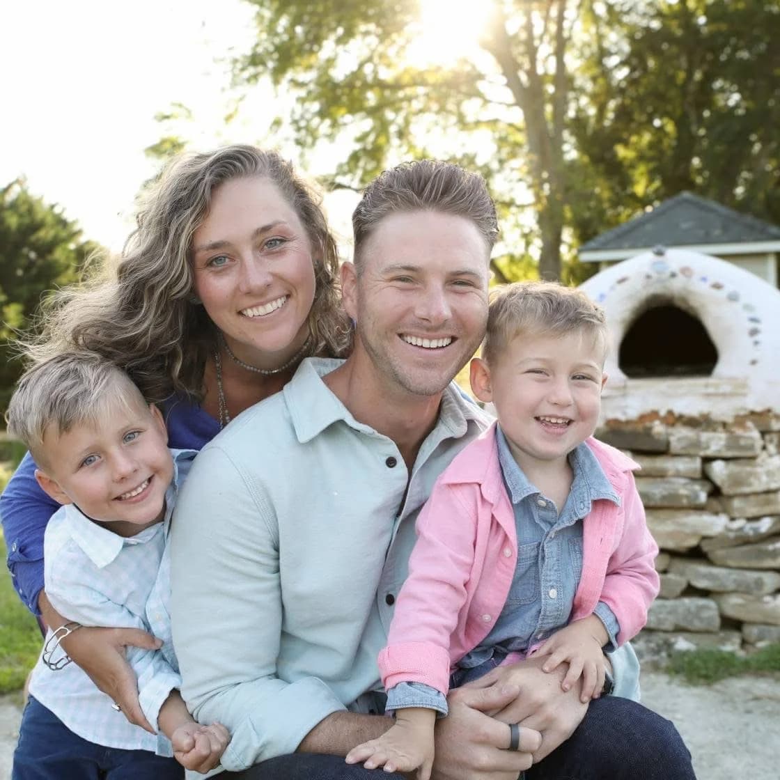Chiropractor Dr. Tony Miller and his family together smiling