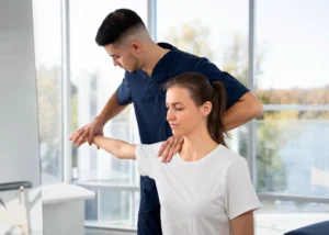 Chiropractor treating patient recovering from car accident injury