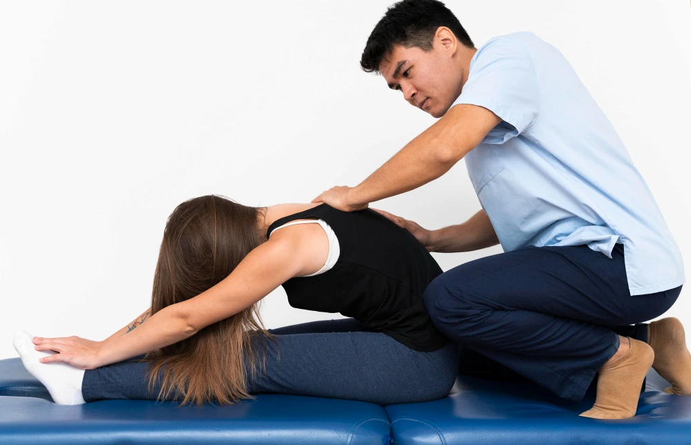 Chiropractor explaining treatment timeline to patient